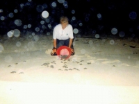 Eve Releasing Baby Turtles in Cozumel